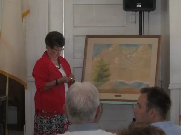 Jo Ann Agee placing stars to represent those who passed